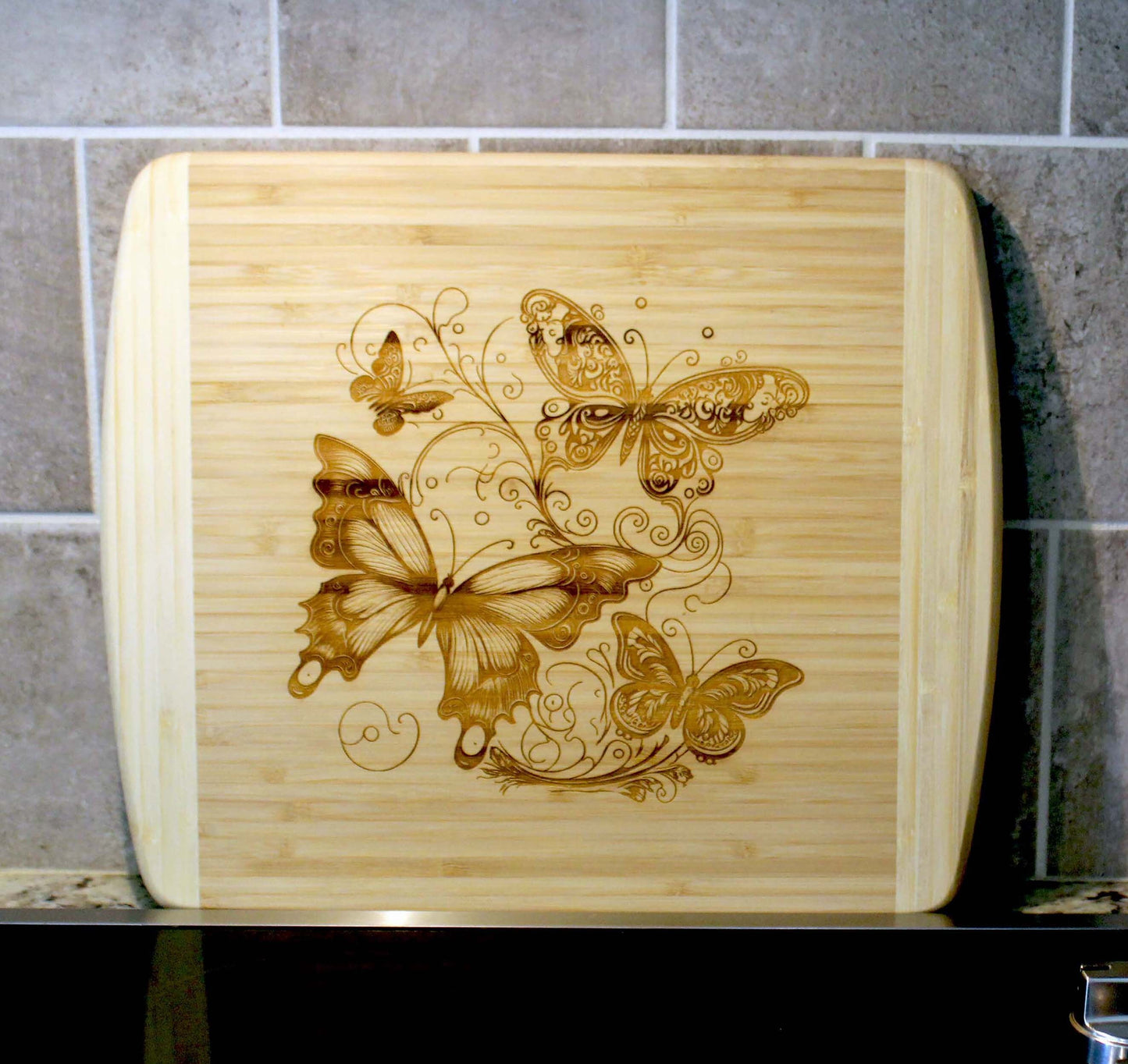 Fluttering Butterflies Decorate this Bamboo Cutting Board and can be Personalized, Environmentally Friendly Gifts and Wood Easel Include