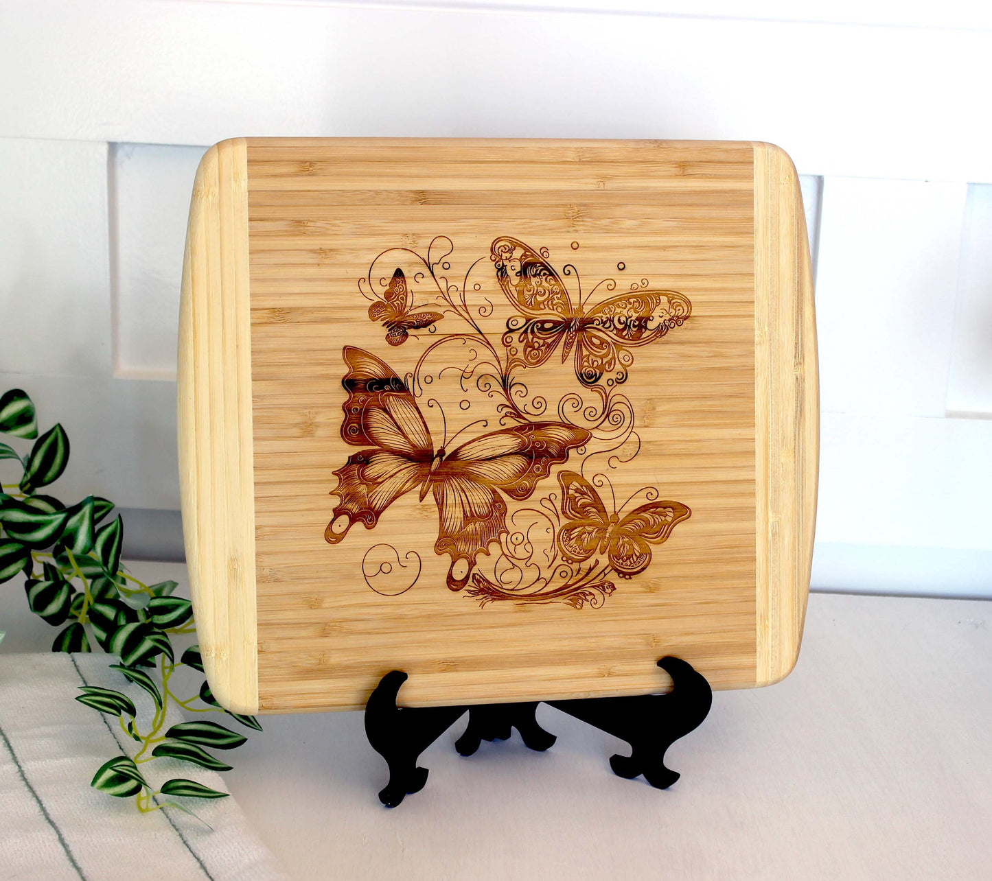Fluttering Butterflies Decorate this Bamboo Cutting Board and can be Personalized, Environmentally Friendly Gifts and Wood Easel Include
