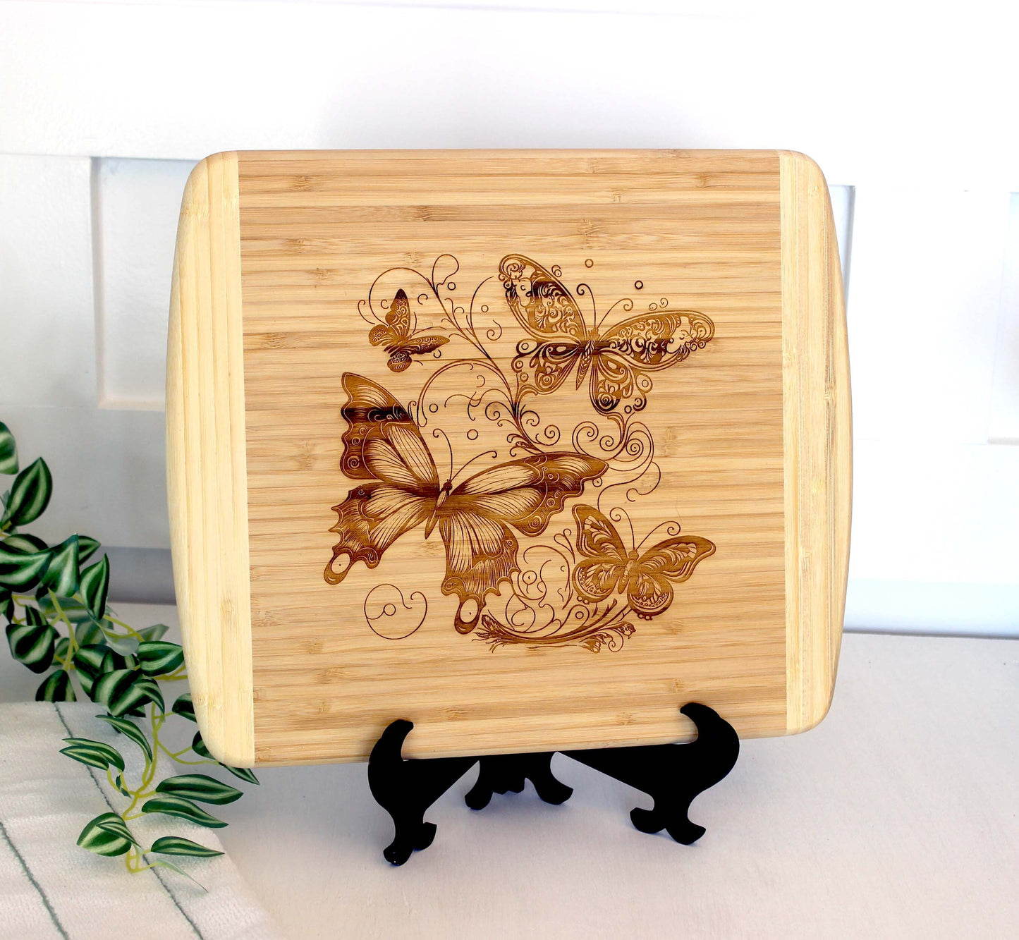 Fluttering Butterflies Decorate this Bamboo Cutting Board and can be Personalized, Environmentally Friendly Gifts and Wood Easel Include