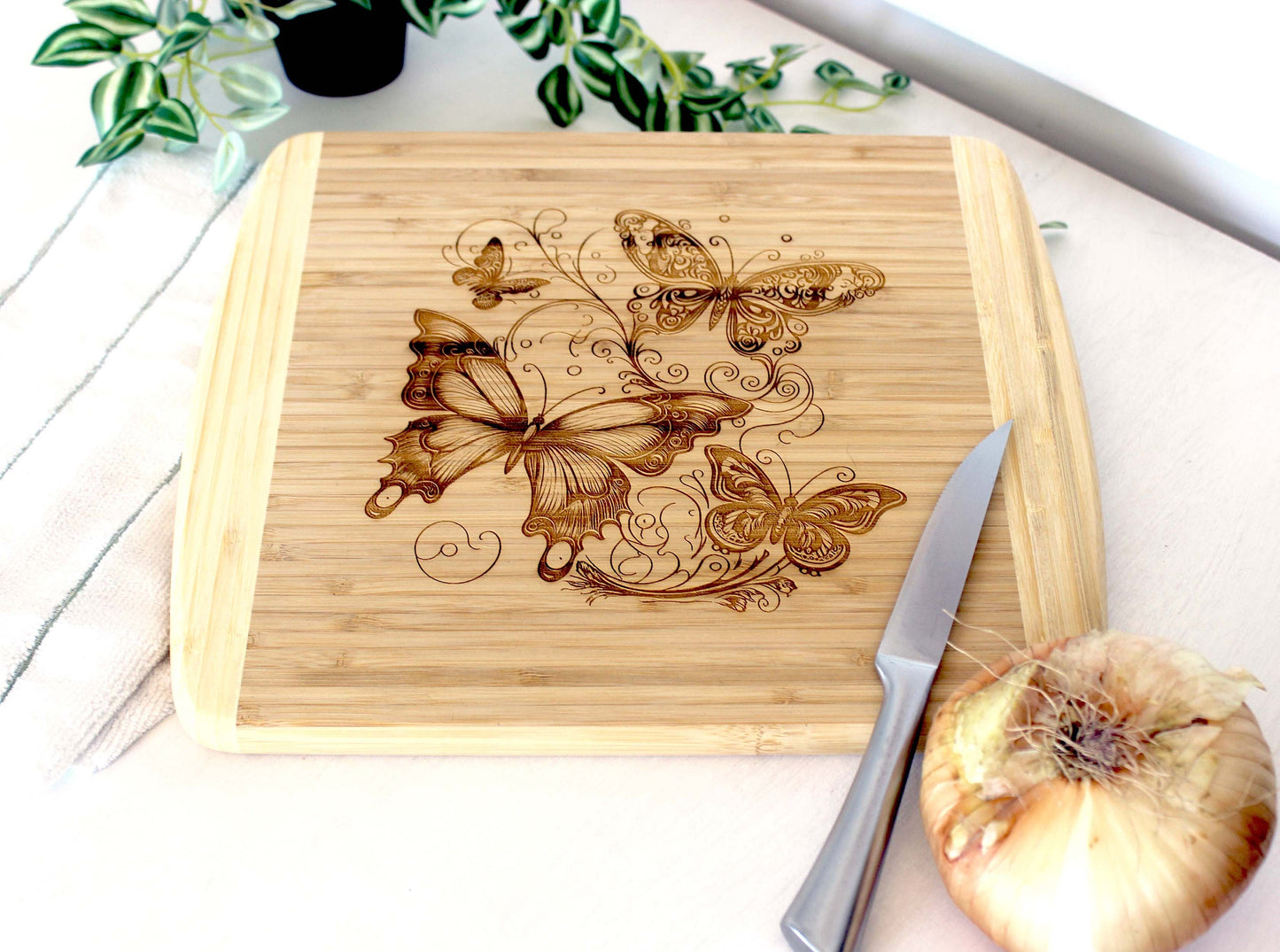 Fluttering Butterflies Decorate this Bamboo Cutting Board and can be Personalized, Environmentally Friendly Gifts and Wood Easel Include