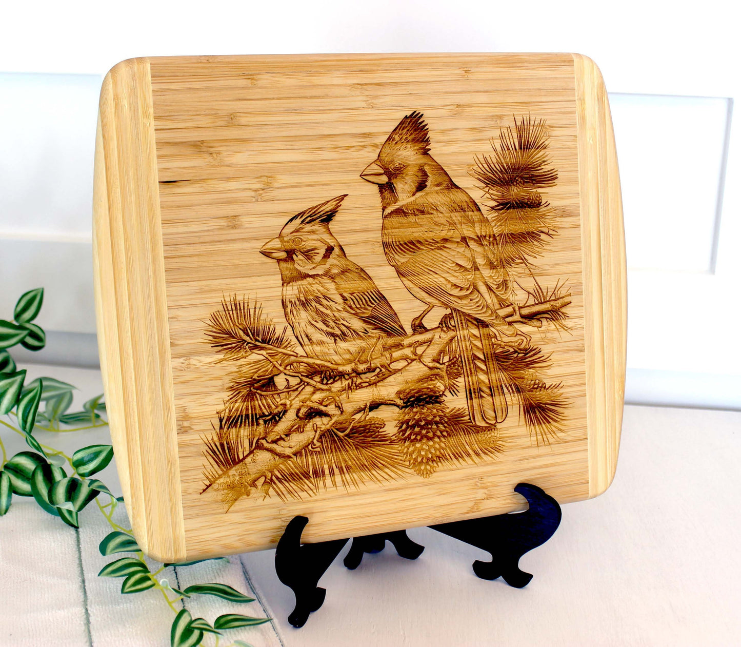 Cardinals on Pine Tree Limb Decorate this Bamboo Cutting Board & can be Personalized, Environmentally Friendly Gifts and Wood Easel Include