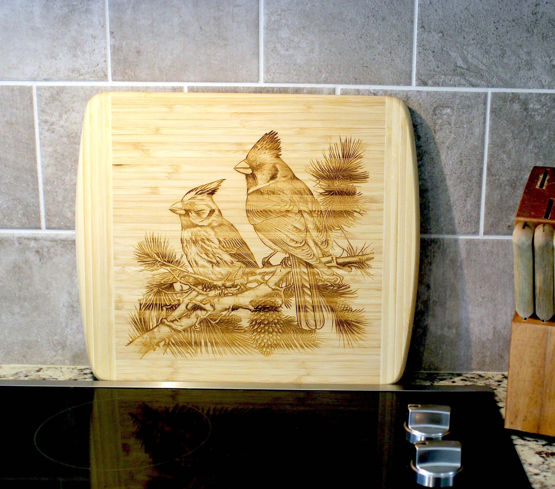Cardinals on Pine Tree Limb Decorate this Bamboo Cutting Board & can be Personalized, Environmentally Friendly Gifts and Wood Easel Include