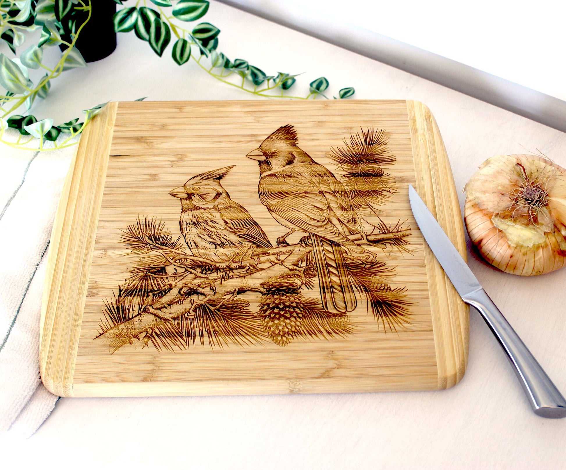 Cardinals on Pine Tree Limb Decorate this Bamboo Cutting Board & can be Personalized, Environmentally Friendly Gifts and Wood Easel Include