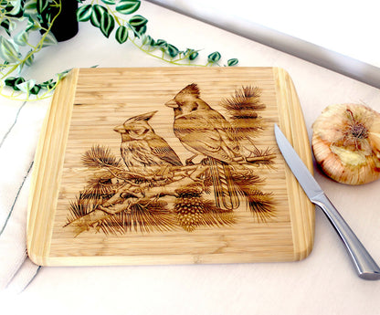 Cardinals on Pine Tree Limb Decorate this Bamboo Cutting Board & can be Personalized, Environmentally Friendly Gifts and Wood Easel Include