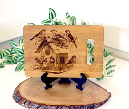 Beautiful Detailed Birdhouse/Birds Engraved on a Bamboo Cheese Cutting Board. Decorate your Kitchen. Wooden easel included.