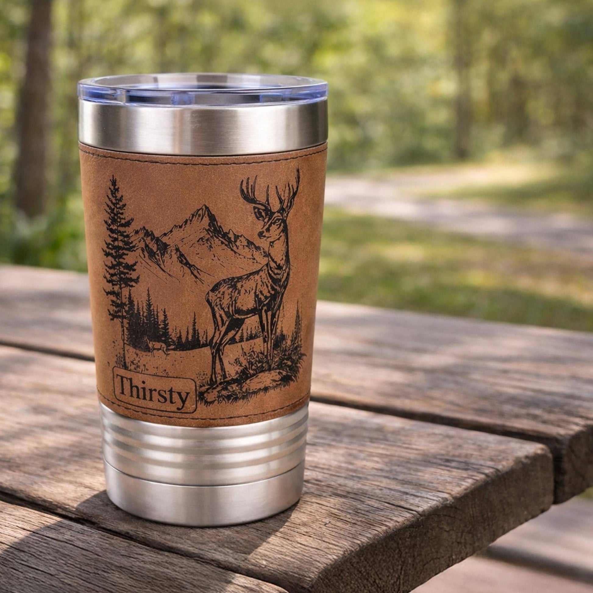 A New Deer in the Mountains Design is Engraved on Leather wrapped travel mug, the Perfect Deer Hunter Gift for Men & Women who love to Hunt