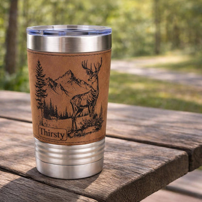 A New Deer in the Mountains Design is Engraved on Leather wrapped travel mug, the Perfect Deer Hunter Gift for Men & Women who love to Hunt