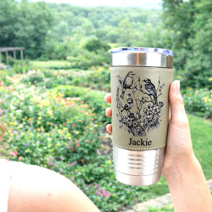 Beautiful Detailed Cherry Blossoms/Birds Engraved on this Insulated Coffee Travel Mug made of Stainless Steel and wrapped with Leatherette