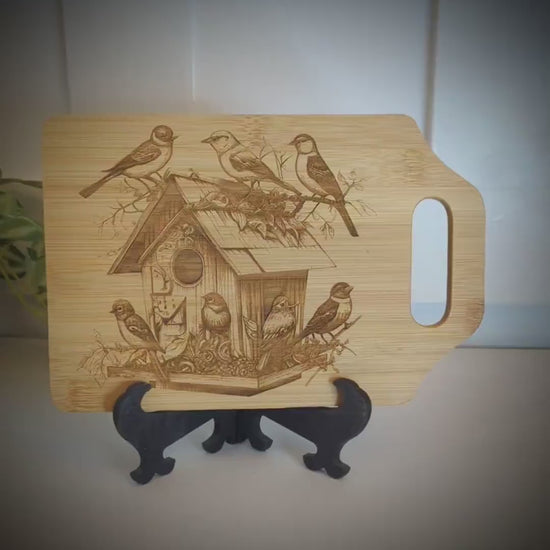 Beautiful Detailed Birdhouse/Birds Engraved on a Bamboo Cheese Cutting Board. Decorate your Kitchen.  Wooden easel included.