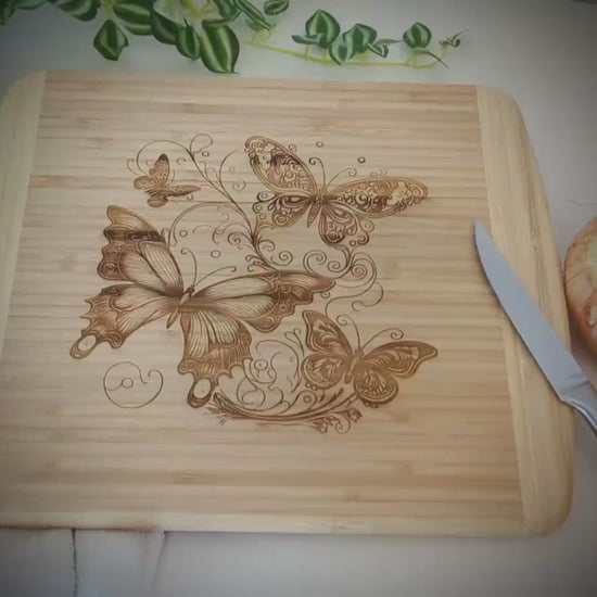 Fluttering Butterflies Decorate this Bamboo Cutting Board and can be Personalized, Environmentally Friendly Gifts and Wood Easel Include