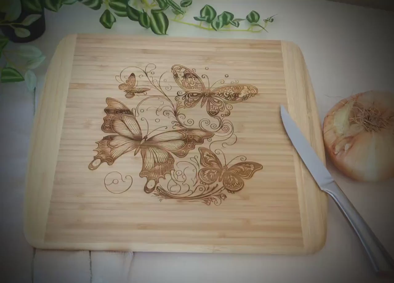 Fluttering Butterflies Decorate this Bamboo Cutting Board and can be Personalized, Environmentally Friendly Gifts and Wood Easel Include